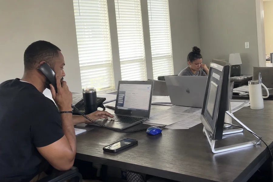 Broken Lease Team agents at their desks