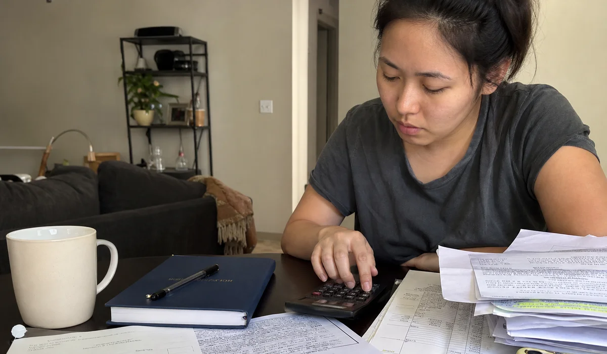 Renter adding up total move-in costs with a guarantor fee