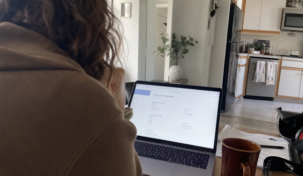 Renter comparing rental screening vendors on a laptop