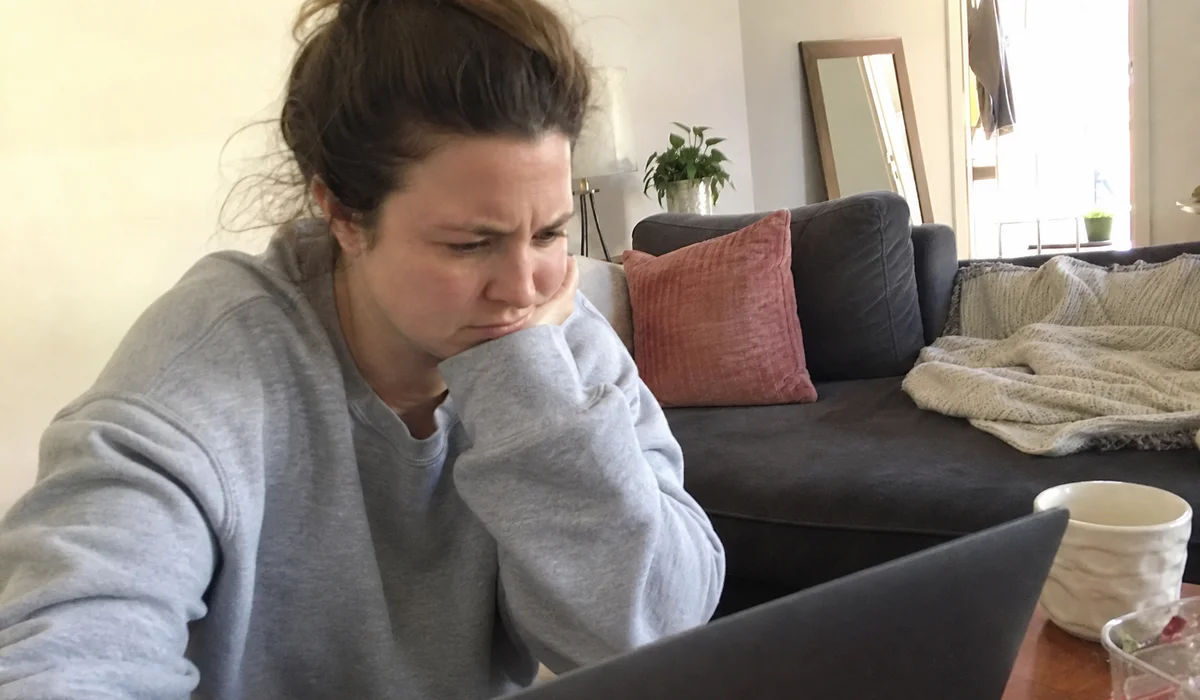 Renter reading a policy notice about guarantor limits