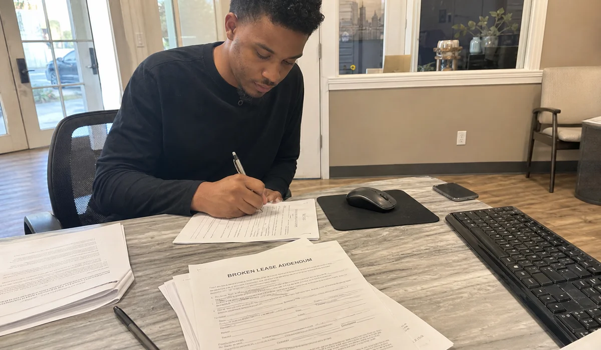 Renter signing a conditional-approval lease