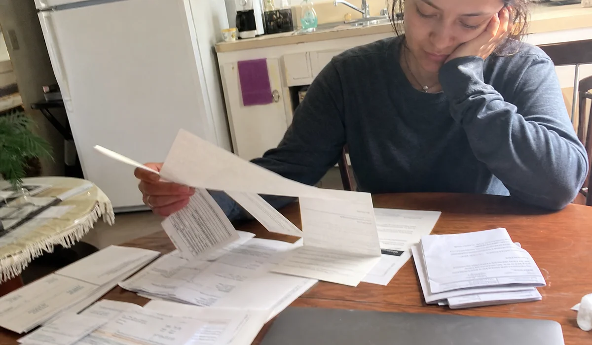 Renter sorting through different collection statements