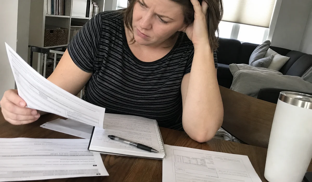 Renter studying dates on a credit report