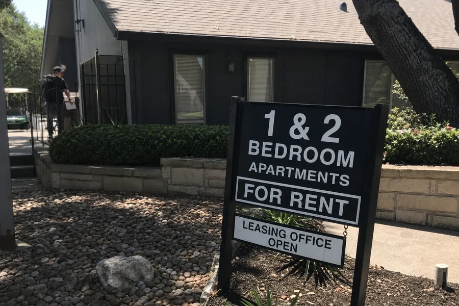 Texas apartment building with a for-rent sign during summer lease season